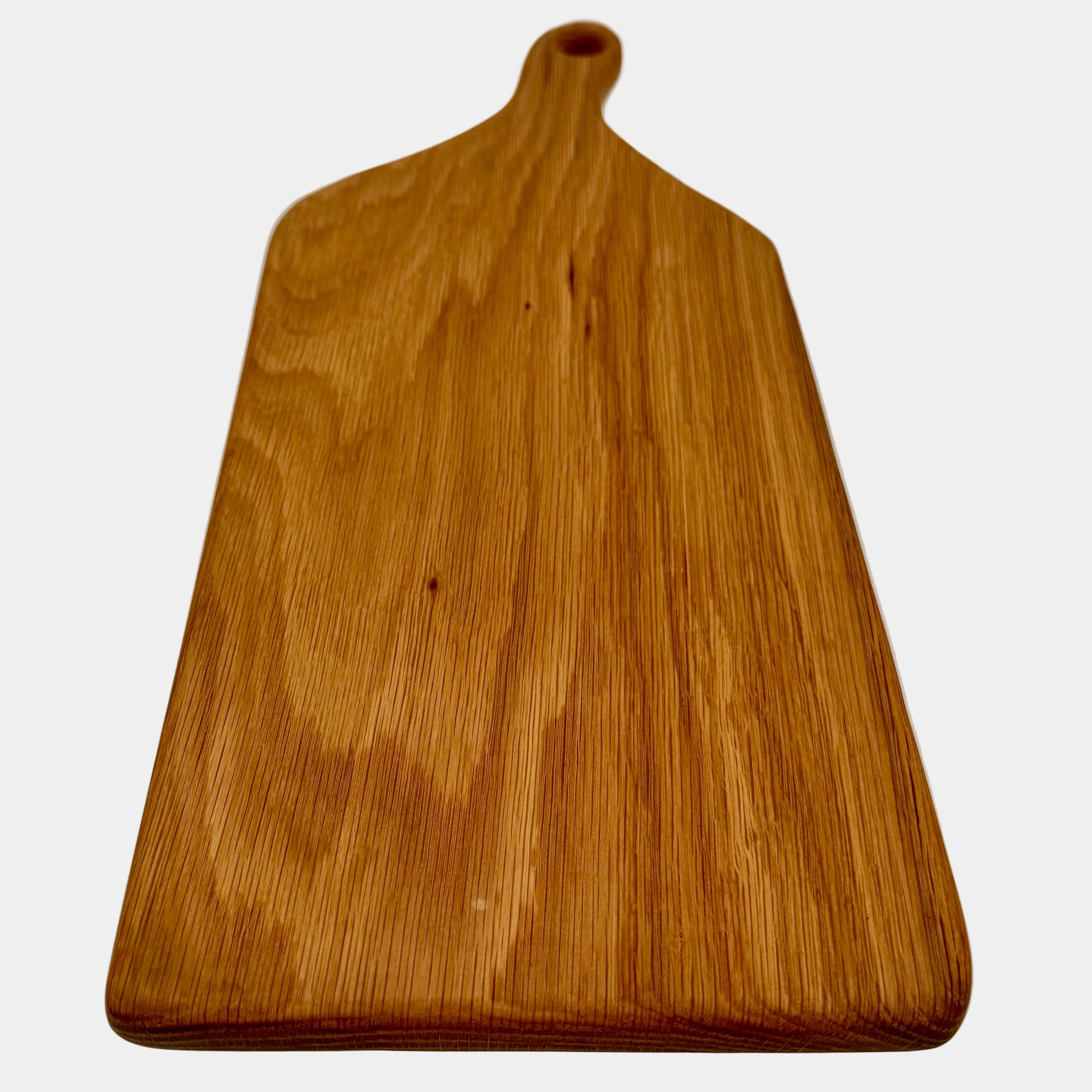 Wooden cutting board with a handle on a white background